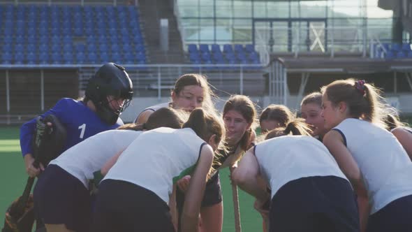 Female hockey players preparing match on the field