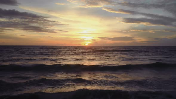 Flight at Sunset Overlooking the Indian Ocean in Bali Indonesia