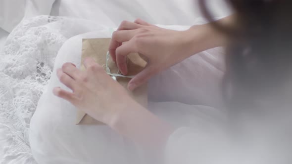 Woman Opening Letter from Lover