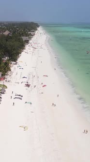 Vertical Video Kitesurfing Near the Shore of Zanzibar Tanzania