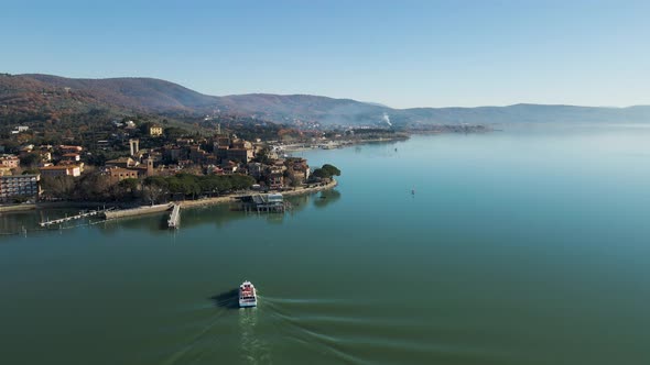 Aerial view of a Sailboat on Passignano sul Trasimeno, Italy.