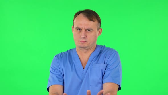 Medical Man Strictly Gesturing with Hands Shape Meaning Denial Saying NO. Green Screen