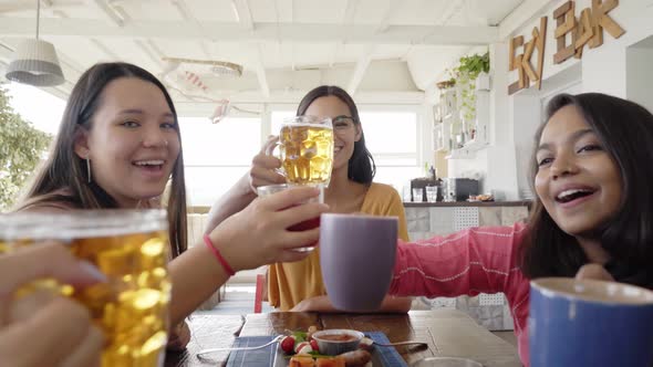 Multicultural People Having Breakfast Drinking Coffee and Cheers