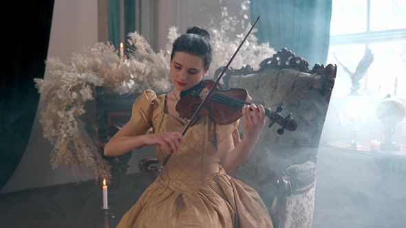 Girl In An Armchair With A Violin