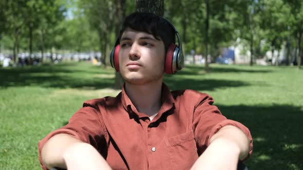 Youth Listening Music at Park