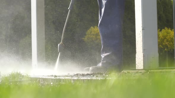 Garden Patio Pressure Washing by Caucasian Men