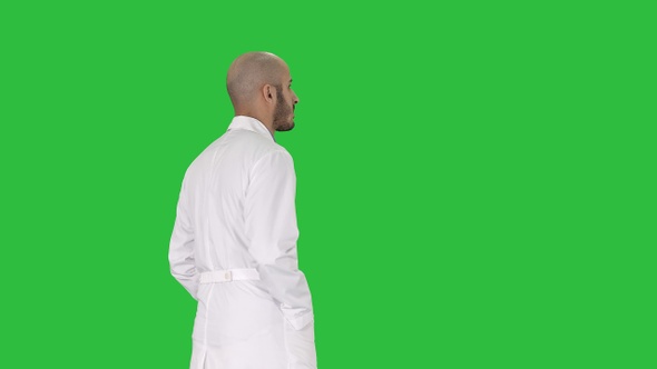 Walking doctor in a robe on a Green Screen, Chroma Key.