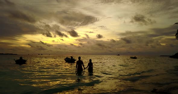 Fun couple after marriage in love enjoy luxury on beach on clean white sand 4K background