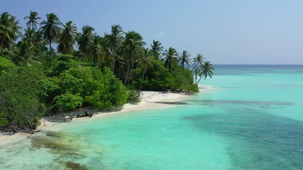 Aerial flying over landscape of beautiful seashore beach vacation by blue ocean and white sand backg