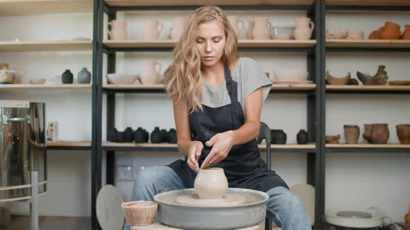 Creativity Female Ceramist Makes a Pitcher Out of Clay Handicraft Production of Handmade Tableware