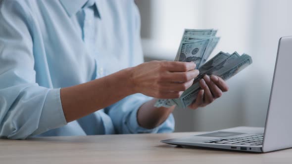 Unrecognizable Female Cashier Hands Woman Counting Large Stack of Hundred American Dollar Bills