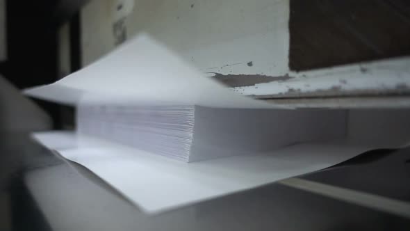 Paper Cutting Process, Close-up, Cutter for Cutting Paper Guillotine. Slow Motion 250FPS (Video