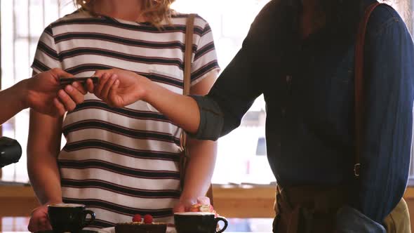 Customer making payment through payment terminal