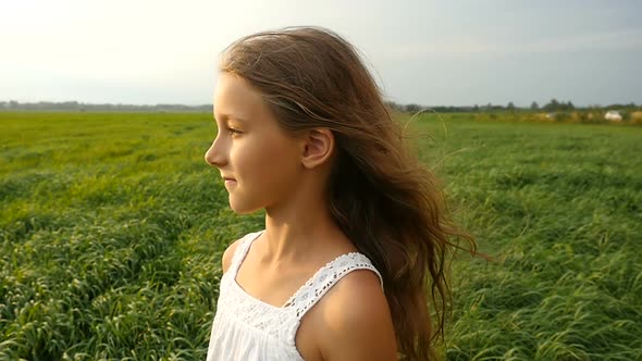 Cute Kid Walking on Green Grass Cute Kid Walking on Green Grass