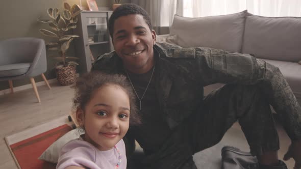 POV of African American Soldier with Little Daughter at Home alt