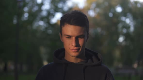 Man Coming Out of Shadow, Looking at Camera, Ready for Positive Life Changes