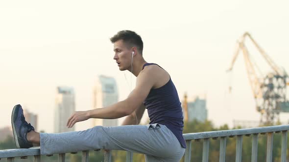 Athlete Doing Morning Exercises and Running Along Street to Recover from Injury