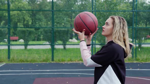 Blonde Playing Basketball or Volleyball on Court