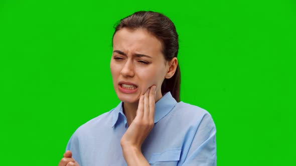 Woman suffering from annoying strong teeth pain.