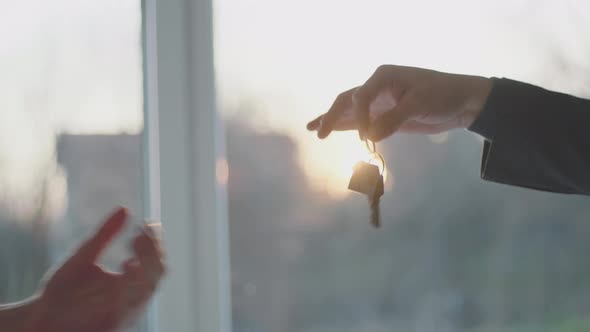 Man gives house key to the buyer