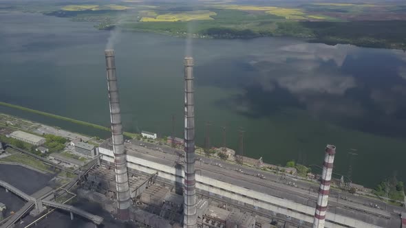 Thermal Power Plant on the Background of an Artificial Reservoir. Video From the Drone. Electricity