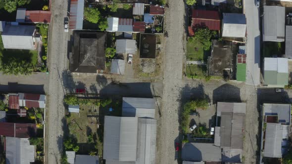 Top down aerial view of a street with small houses