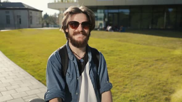 Student Stands Near Bike