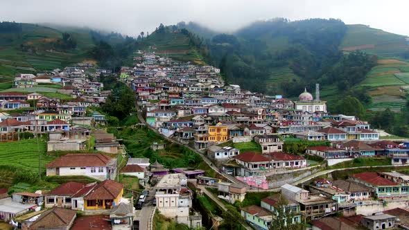 Terraced village and farmland fields on Mount Sumbing foothill aerial, Indonesia