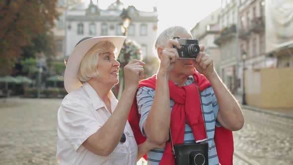 Senior Male and Female Tourists Makes a Photo While Traveling in Lviv, Ukraine