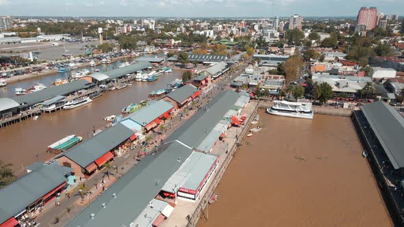 Aerial establishing shot of Puerto de Frutos, a tourist attraction in Tigre city, Argentina