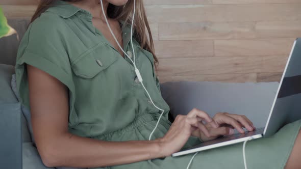 Woman Working on Laptop on Daybed