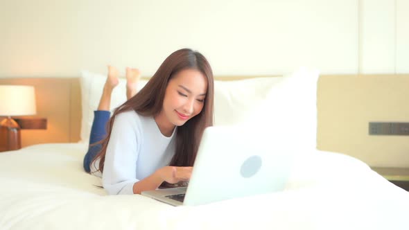 Young asian woman use laptop