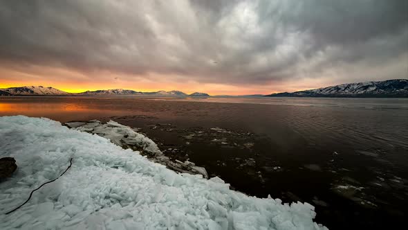 Sunrise Over Lake as the Ice is Melting