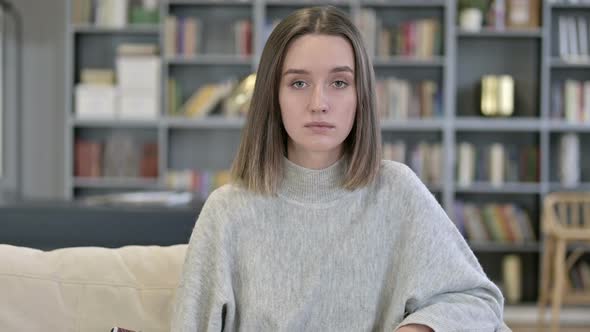 Portrait of Young Woman Looking at the Camera 