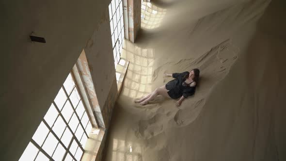 Young Woman in Black Shirt and Underwear in Abandoned Building Posing in Room