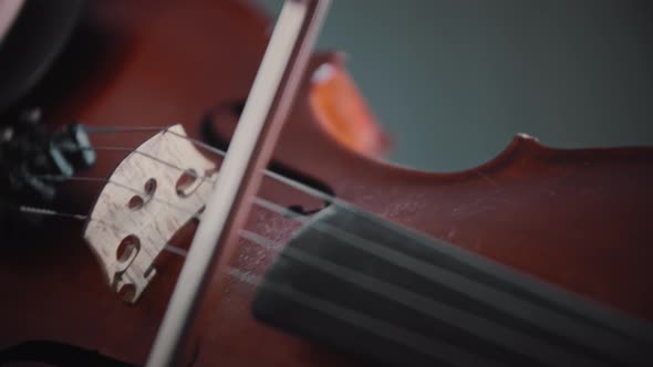 Young Woman Playing Violin  Playing with a Bow on the Strings