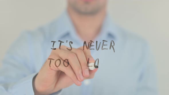 It's Never Too Late, Man Writing on Transparent Glass Screen