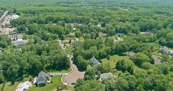 Aerial Panorama View Residential Neighborhood Apartment Complex in American Town on Between Forest