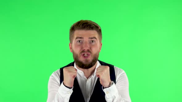 Man Looking at the Camera with Excitement, Then Celebrating His Victory Triumph on Green Screen