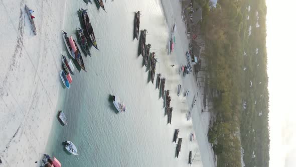 Vertical Video Boats in the Ocean Near the Coast of Zanzibar Tanzania Aerial View