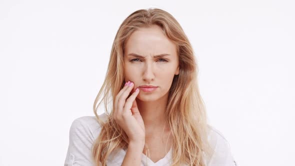 Young Beautiful Caucasian Blonde Girl Flirting at Camera Ogling Raising Eyebrows on White Background