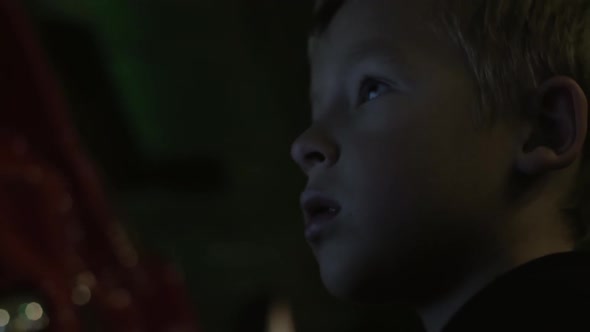 Kid Playing with Amusement Machine