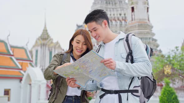 Asian attractive romantic couple travel in the city for honeymoon trip on holiday vacation together