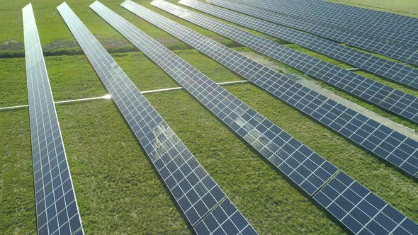 Flying Over Solar Panels Park on Sunny Day Aerial View