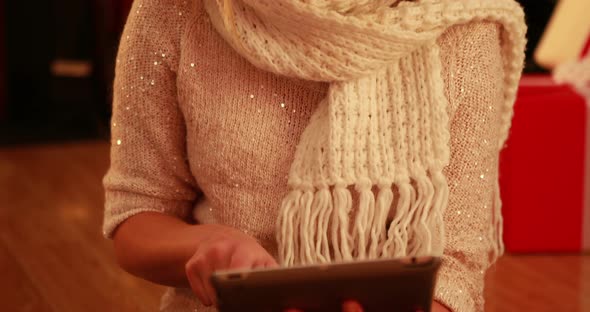 Pretty blonde using tablet at christmas 4k