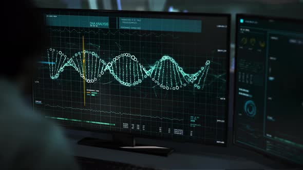 A doctor is using Medical research software The DNA Strand is being analyzed. alt