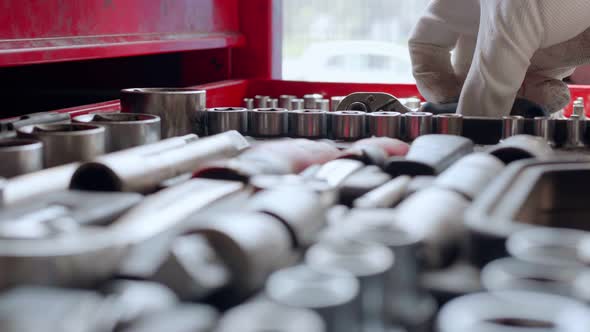 Auto Mechanic Pulls Out a Tool From the Tray