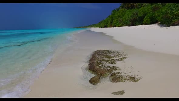 Aerial scenery of exotic lagoon beach holiday by blue water and white sandy background of a dayout n