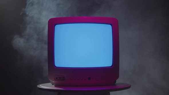 Old Vintage Television on Black Background with Smoke