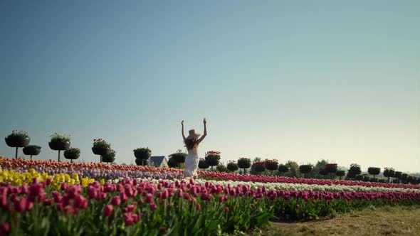 Girl Running Tulip Field View